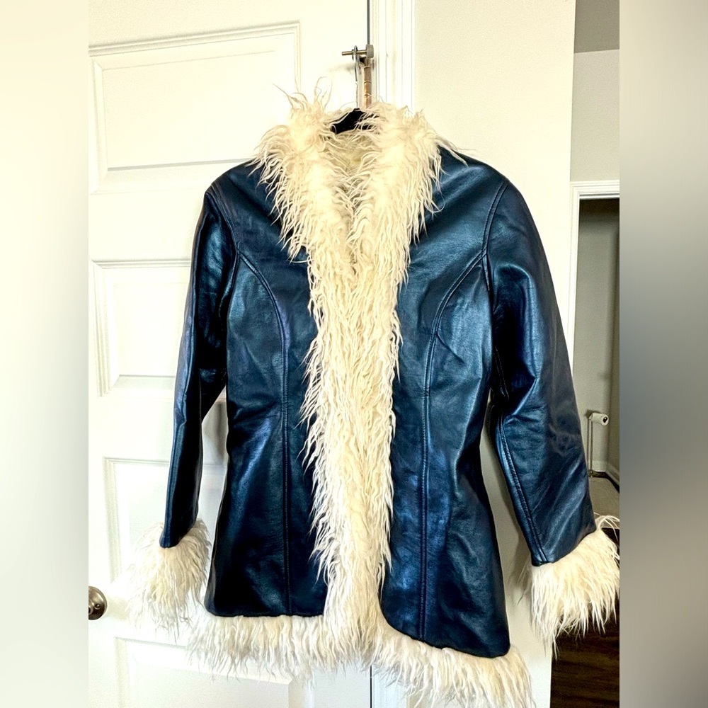 Vintage blue faux leather jacket/coat with white fur lining the trim. Size M
